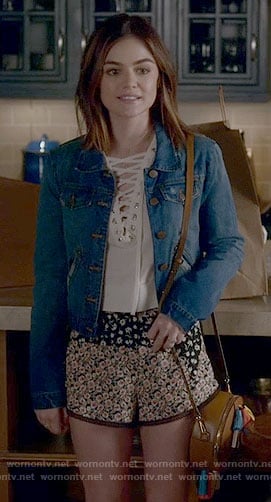 Aria’s white lace-up top and floral shorts on Pretty Little Liars