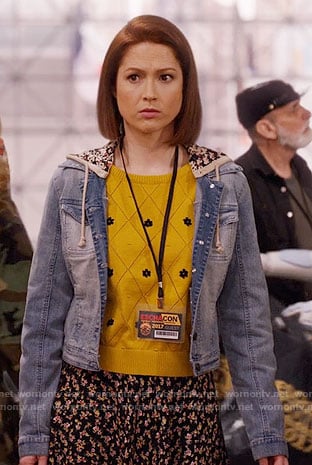 Kimmy’s yellow daisy sweater and hooded denim jacket on Unbreakable Kimmy Schmidt