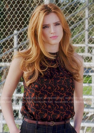 Paige’s black and orange printed top on Famous in Love