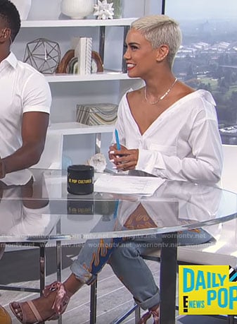 Sibley’s white off-shoulder shirt and flame embroidered jeans on E! News Daily Pop