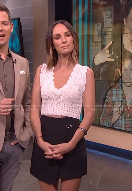 Catt’s black wrap mini skirt on E! News