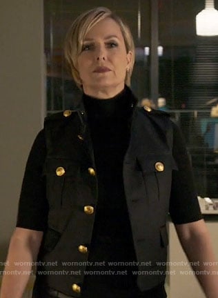 Jacqueline's black vest with gold buttons on The Bold Type