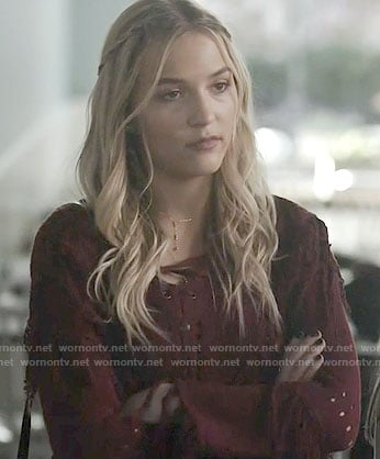 Maddie’s red lace-up sweater on Nashville