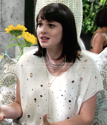 Tessa’s white distressed top on The Young and the Restless