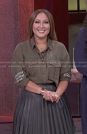 Adrienne’s khaki shirt and black pleated skirt on The Real