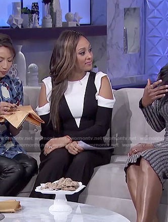 Tamera’s white and black cold-shoulder jumpsuit on The Real