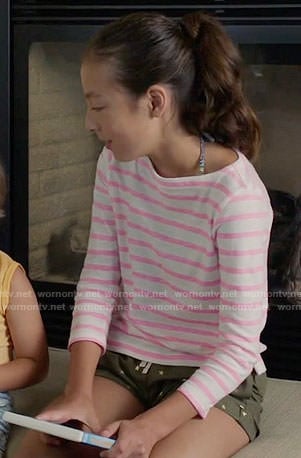 Lily’s pink striped top and star print shorts on Modern Family