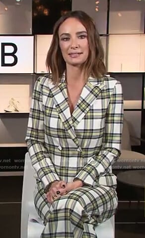 Catt’s plaid jumpsuit and jacket on E! News Daily Pop