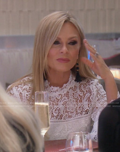 Tamra’s white lace bell sleeved top on The Real Housewives of OC