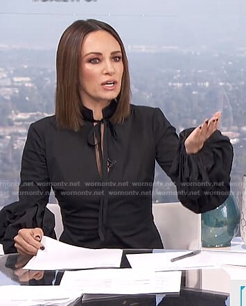 Catt’s black balloon sleeve tie neck top on E! News Daily Pop