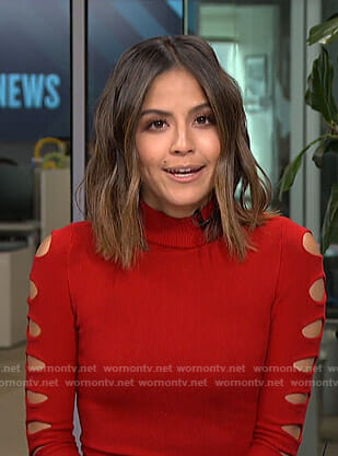 Erin’s red cutout sleeve top on Live from E!