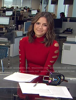Erin’s red cutout sleeve top on Live from E!