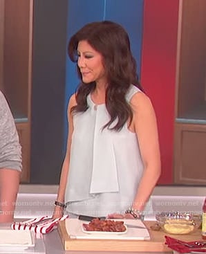 Julie’s blue ruffle sleeveless top on The Talk