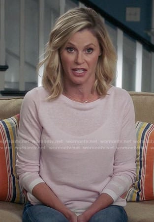 Claire’s pink sweater with striped trim on Modern Family