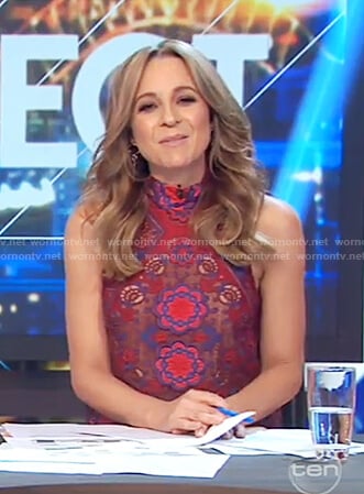 Carrie’s red embroidered floral lace top on The Project