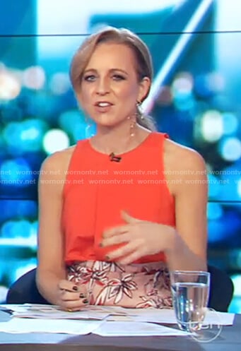 Carrie’s red top and floral printed skirt on The Project