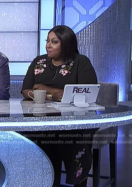 Loni’s black floral embroidered jumpsuit on The Real