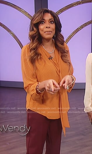 Wendy’s orange bow neck top on The Wendy Williams Show