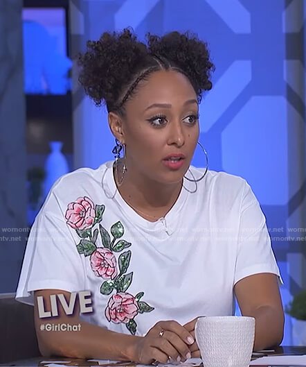 Tamera’s white sequined flower top and black button front skirt on The Real