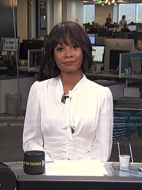 Zuri’s white tie neck blouse on Live from E!