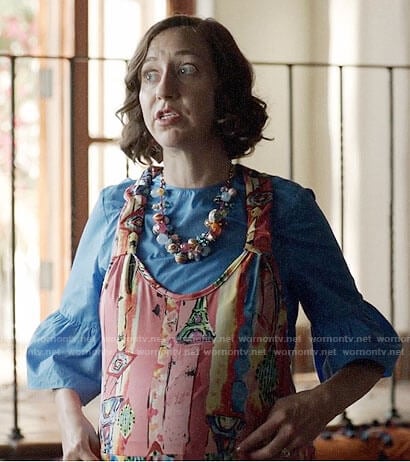 Carol’s blue bell-sleeve top and printed overalls on Last Man on Earth