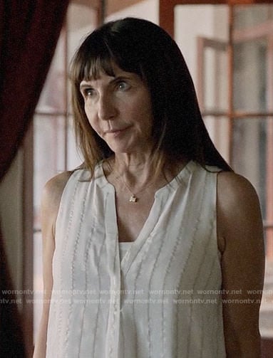 Gail’s white metallic stripe top on Last Man on Earth