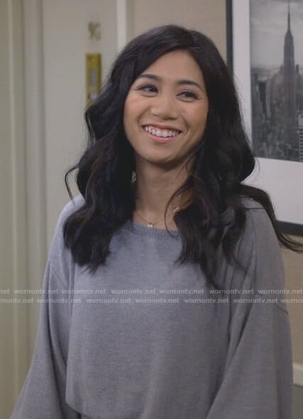 Eve’s gray boat neck ribbed hem sweater on 9JKL