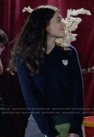 Sabrina’s navy sweater with white heart patch on The Mick