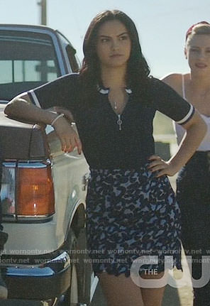 Veronica’s navy zip up top with white trim and patterned skirt on Riverdale