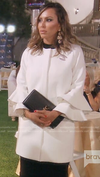 Kelly’s white bell sleeve coat on The Real Housewives of OC