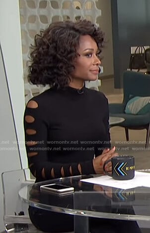 Zuri’s black cutout sleeve top on Live from E!