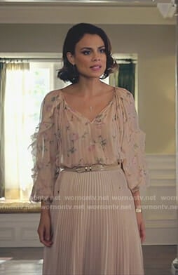 Cristal's pink floral ruffle sleeve blouse and pleated skirt on Dynasty