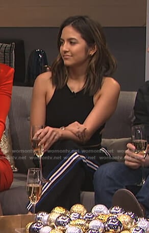 Erin’s black side striped pants on E! News