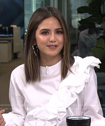 Erin's white ruffle top on Live from E!