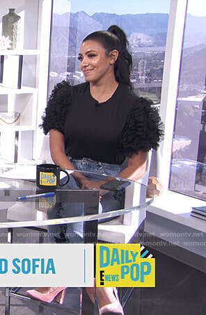 Julissa Bermudez’s black ruffled mesh sleeve top on E! News Daily Pop