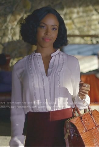 Kori Rucks’s white pleated blouse with pearls on Dynasty