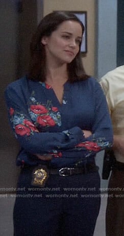 Amy’s blue and pink floral blouse on Brooklyn Nine-Nine