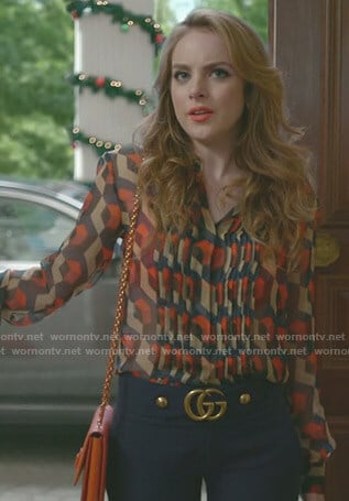 Fallon’s printed blouse and blue cropped pants on Dynasty