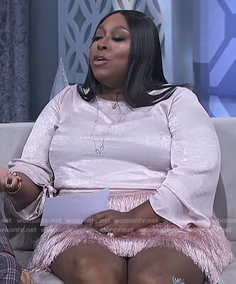 Loni’s pink ruched sleeve top and fringe skirt on The Real