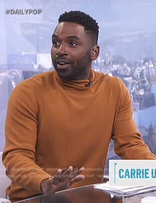 Justin’s orange turtleneck sweater on E! News Daily Pop