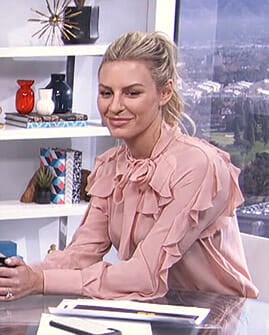 Morgan’s pink ruffled tie neck blouse on E! News Daily Pop