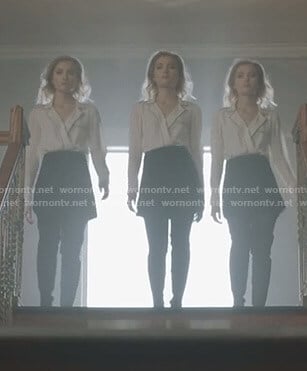 The Stepford Cuckoos' white wrap blouse with black piping on The Gifted