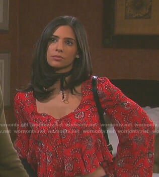 Gabi’s red printed v-neck top on Days of our Lives