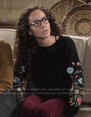 Mattie’s black sweater with floral embroidered sleeves on The Young and the Restless