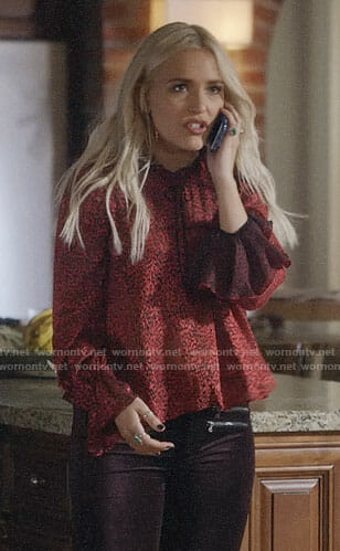 Maddie's red ruffled blouse with tie neck on Nashville