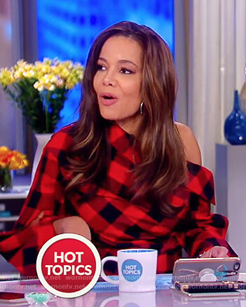 Sunny’s red and black check one off shoulder top on The View