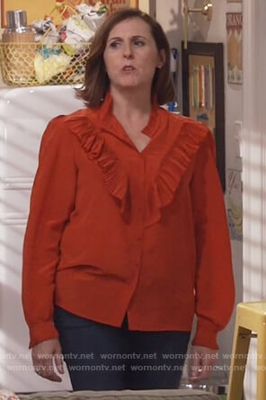 Val’s red ruffle front top on Will and Grace