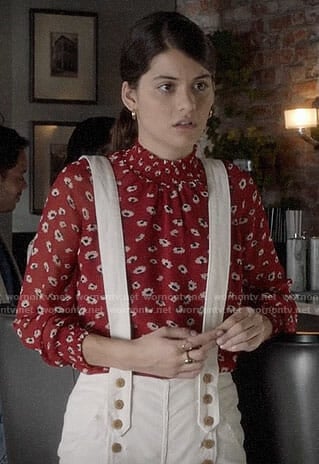 Sabrina’s red floral top and white suspender trousers on The Mick