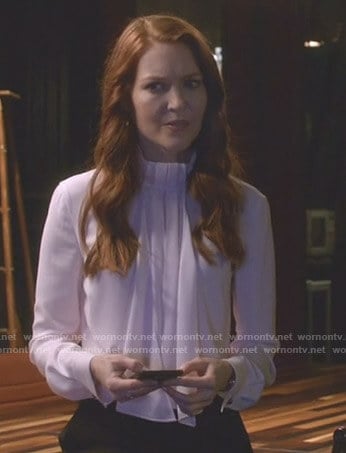 Abby's white scarf tie neck blouse on Scandal