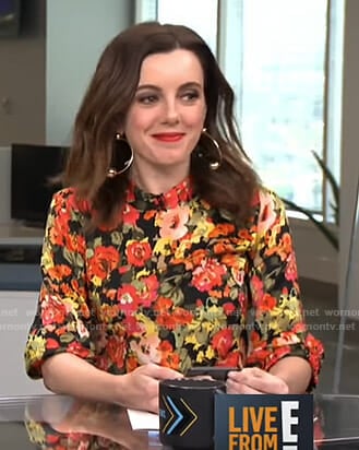 Melanie’s black floral mock neck top on Live from E!